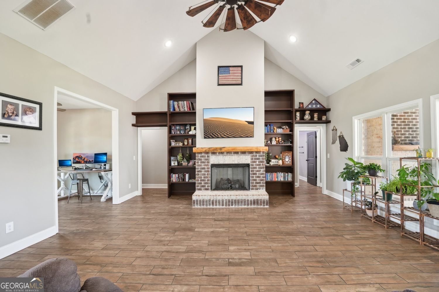 357 Old Driver Road Whitesburg, GA 30185 - Photo 33 of 75 a living room with furniture and a flat screen tv