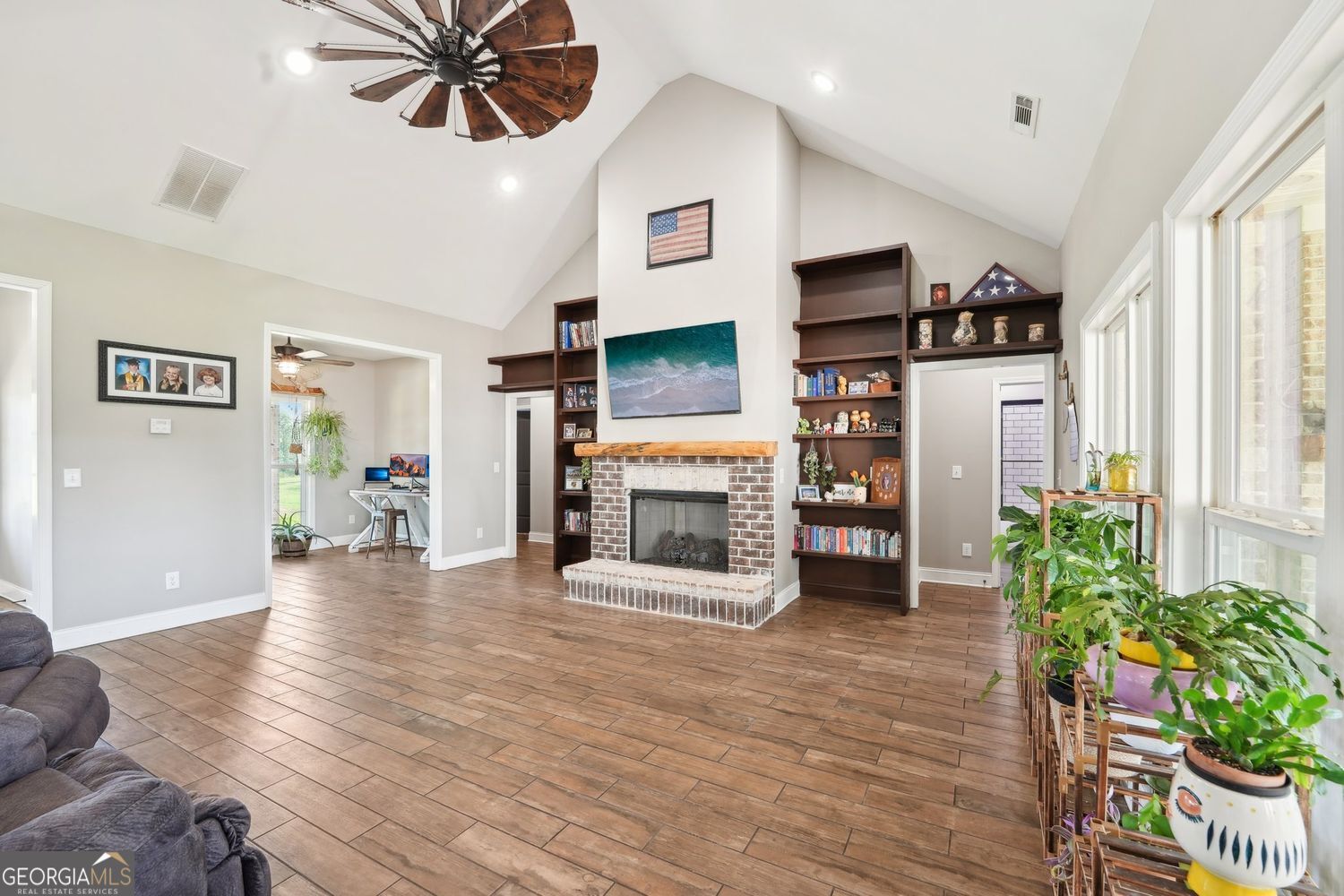 357 Old Driver Road Whitesburg, GA 30185 - Photo 34 of 75 a living room with furniture and a fireplace