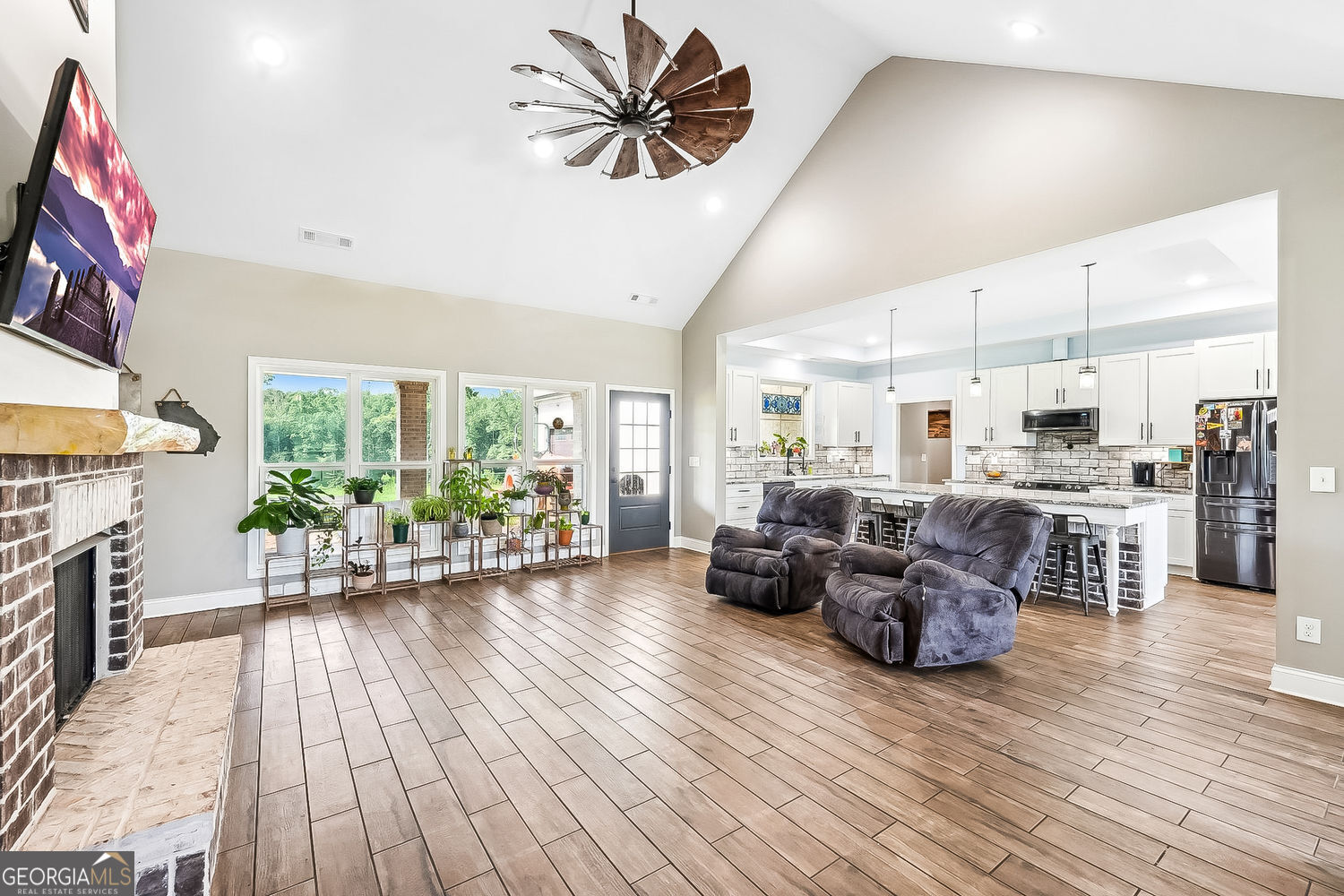 357 Old Driver Road Whitesburg, GA 30185 - Photo 36 of 75 a living room with furniture fireplace and a large window