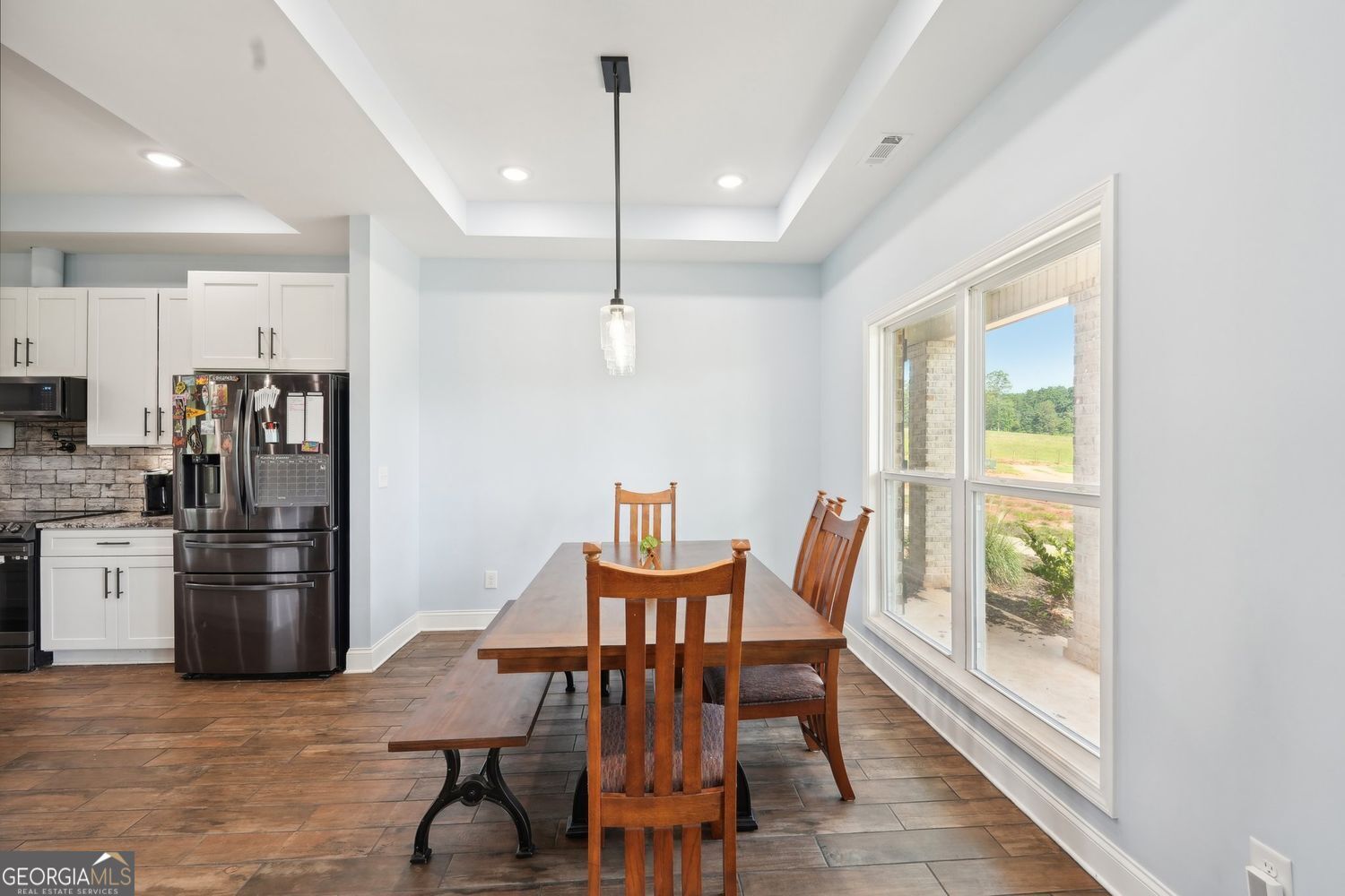 357 Old Driver Road Whitesburg, GA 30185 - Photo 37 of 75 a view of a dining room with furniture window and wooden floor