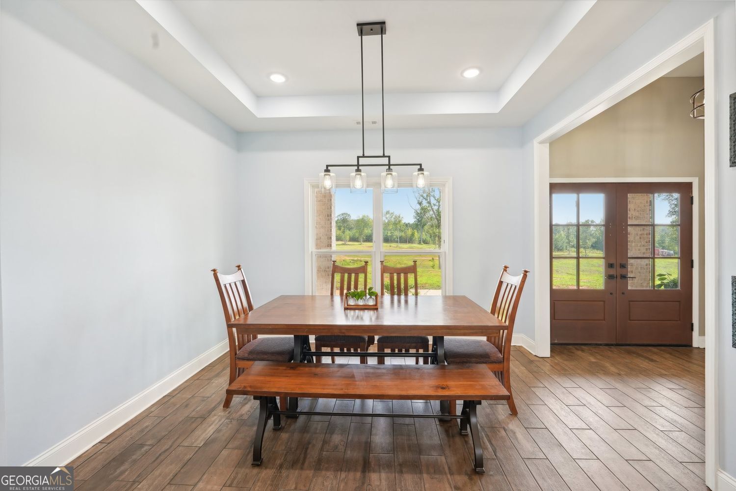 357 Old Driver Road Whitesburg, GA 30185 - Photo 38 of 75 a dining room with furniture a chandelier and wooden floor