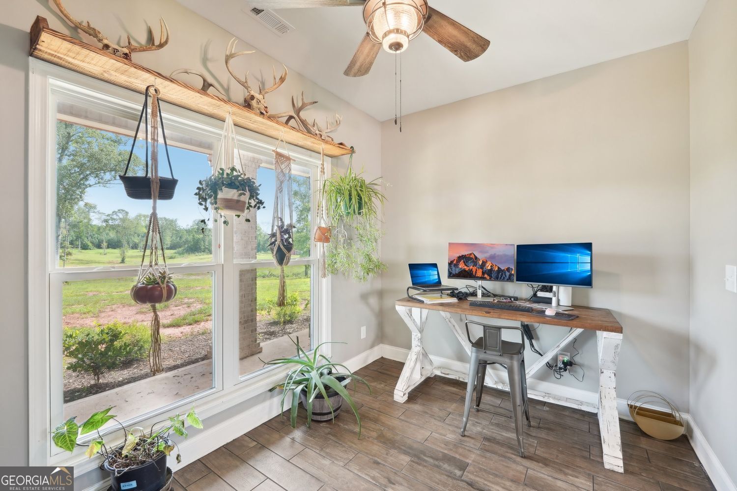 357 Old Driver Road Whitesburg, GA 30185 - Photo 4 of 75 a workspace with furniture and a potted plant
