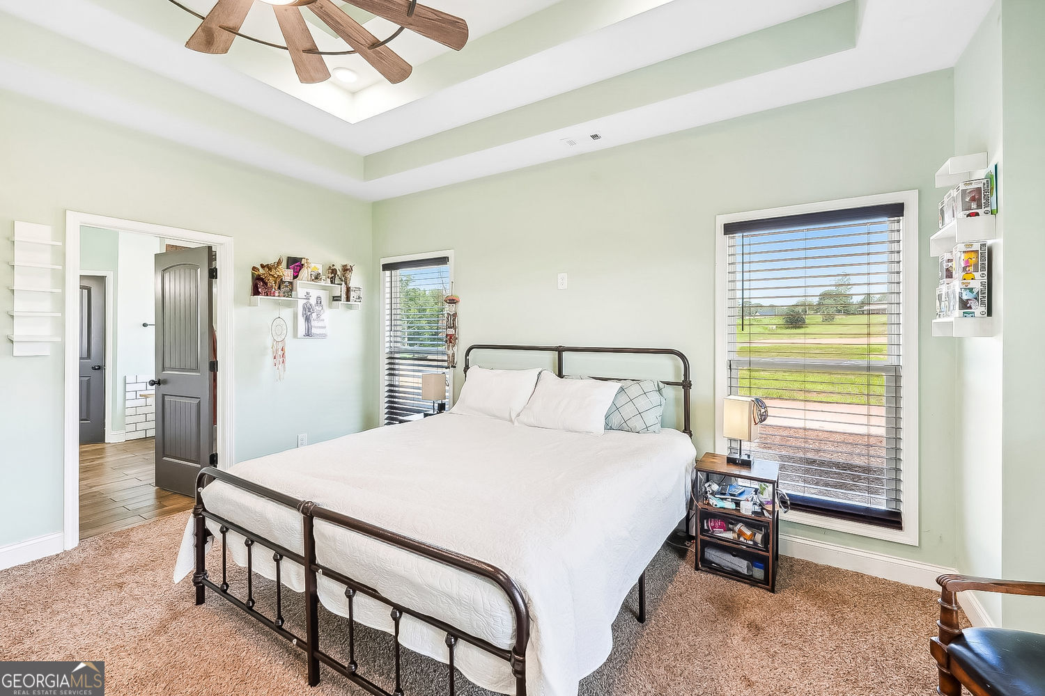 357 Old Driver Road Whitesburg, GA 30185 - Photo 49 of 75 a bedroom with a bed a dresser and a chandelier