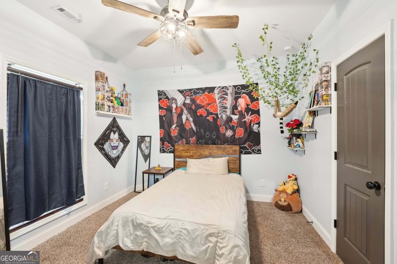 357 Old Driver Road Whitesburg, GA 30185 - Photo 57 of 75 a bedroom with a bed and a chandelier