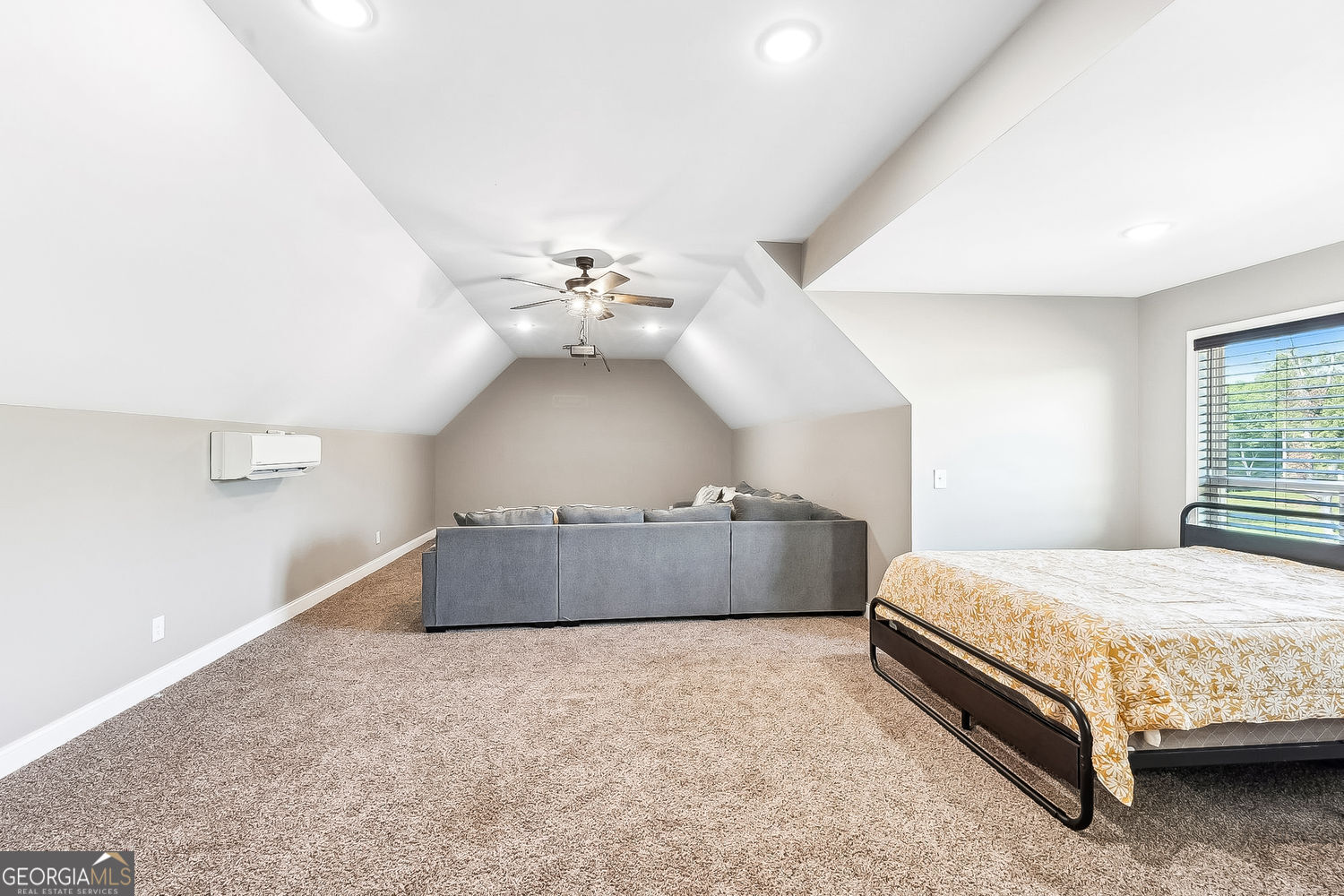 357 Old Driver Road Whitesburg, GA 30185 - Photo 62 of 75 a spacious bedroom with a bed and a chandelier