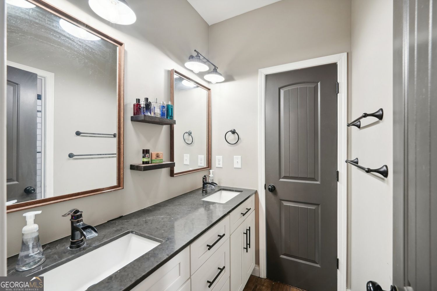 357 Old Driver Road Whitesburg, GA 30185 - Photo 66 of 75 a bathroom with a double vanity sink a mirror and shower