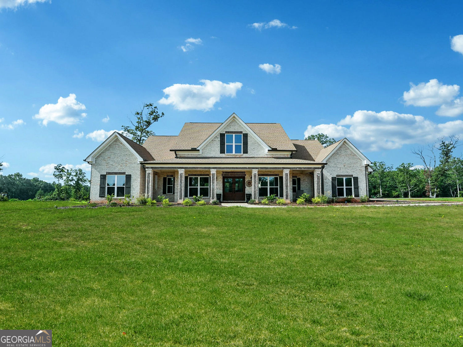357 Old Driver Road Whitesburg, GA 30185 - Photo 8 of 75 a front view of a house with a garden