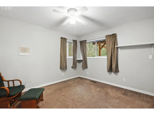 a view of empty room with windows