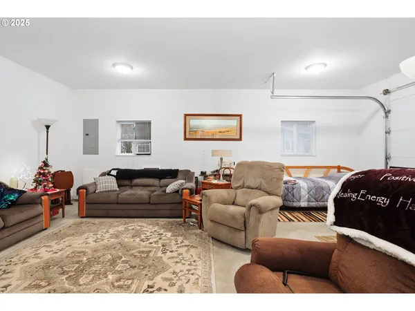 a living room with furniture and a lamp