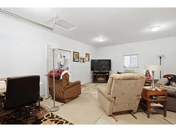 a kitchen with stainless steel appliances kitchen island granite countertop a refrigerator and a sink