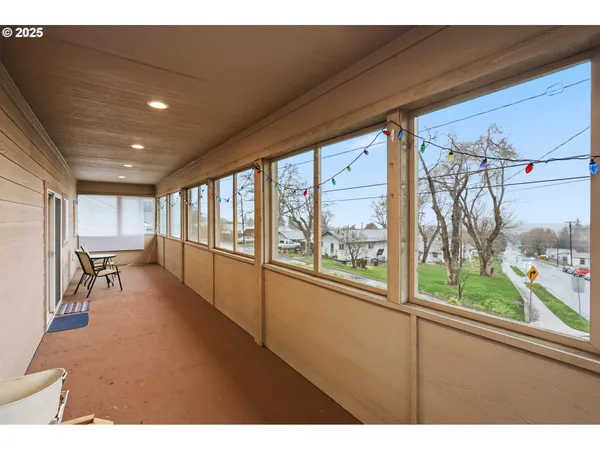 a view of a living room and a floor to ceiling window