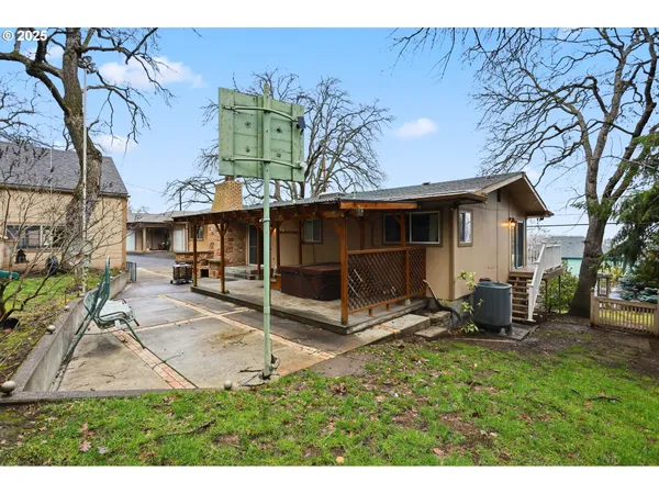 a view of a backyard with a patio