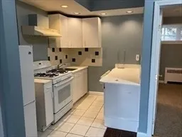 a kitchen with stainless steel appliances a stove a sink and a refrigerator