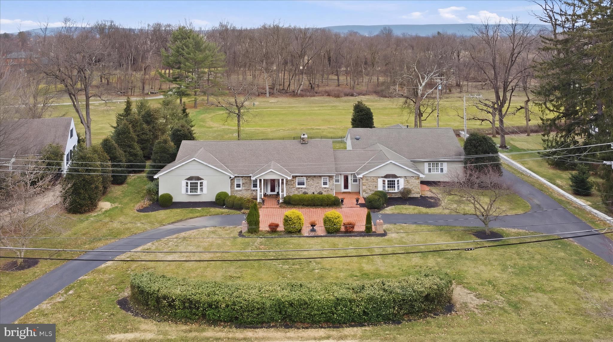 an aerial view of a house with big yard