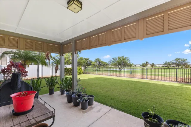 a view of a two chairs and table in the balcony