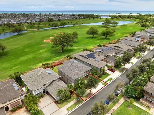 an aerial view of a residential houses with city view