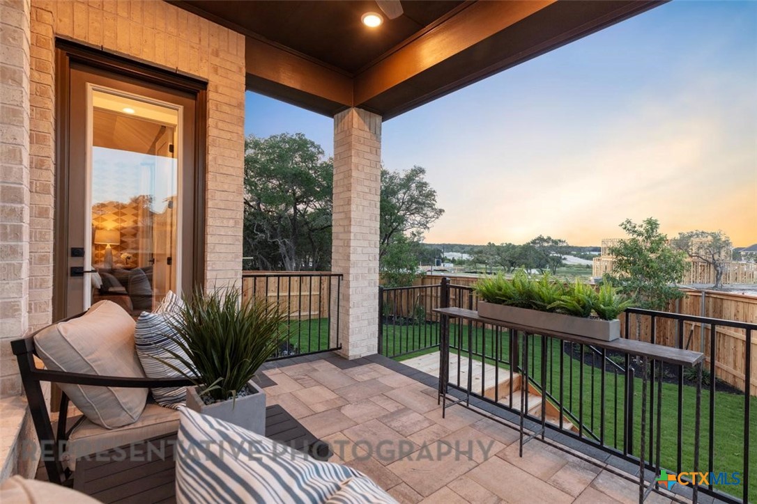 244 Basket Flower Loop Kyle, TX 78640 - Photo 26 of 34 a view of a balcony with furniture