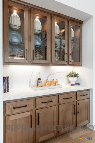 a bathroom with a sink and a large mirror