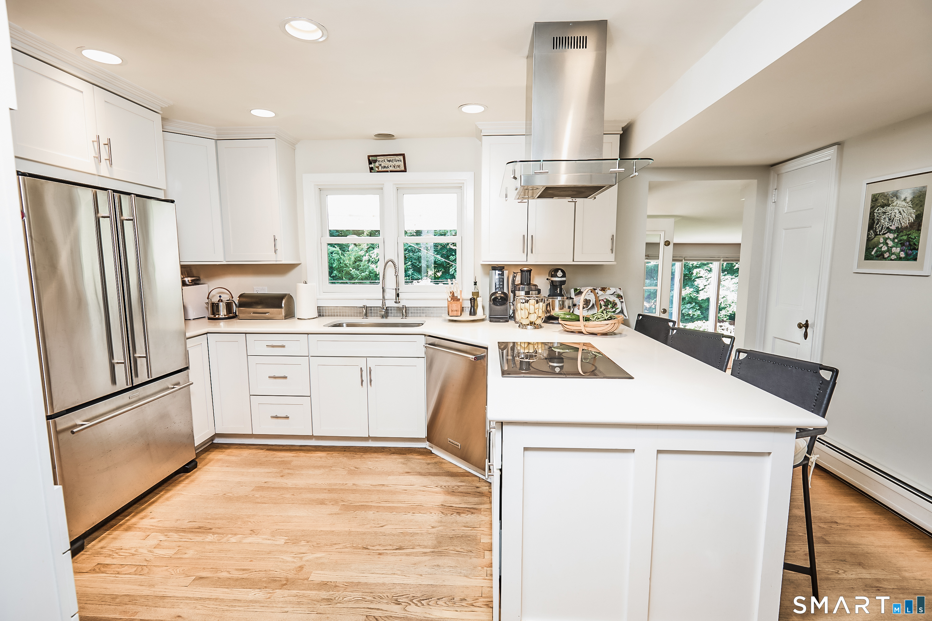 188 Compo Road South Westport, CT 06880 - Photo 11 of 39 a kitchen with a refrigerator a sink and cabinets