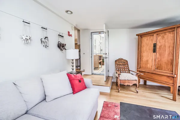 a living room with furniture and a window