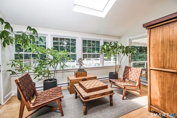 a outdoor living room with furniture and a potted plant