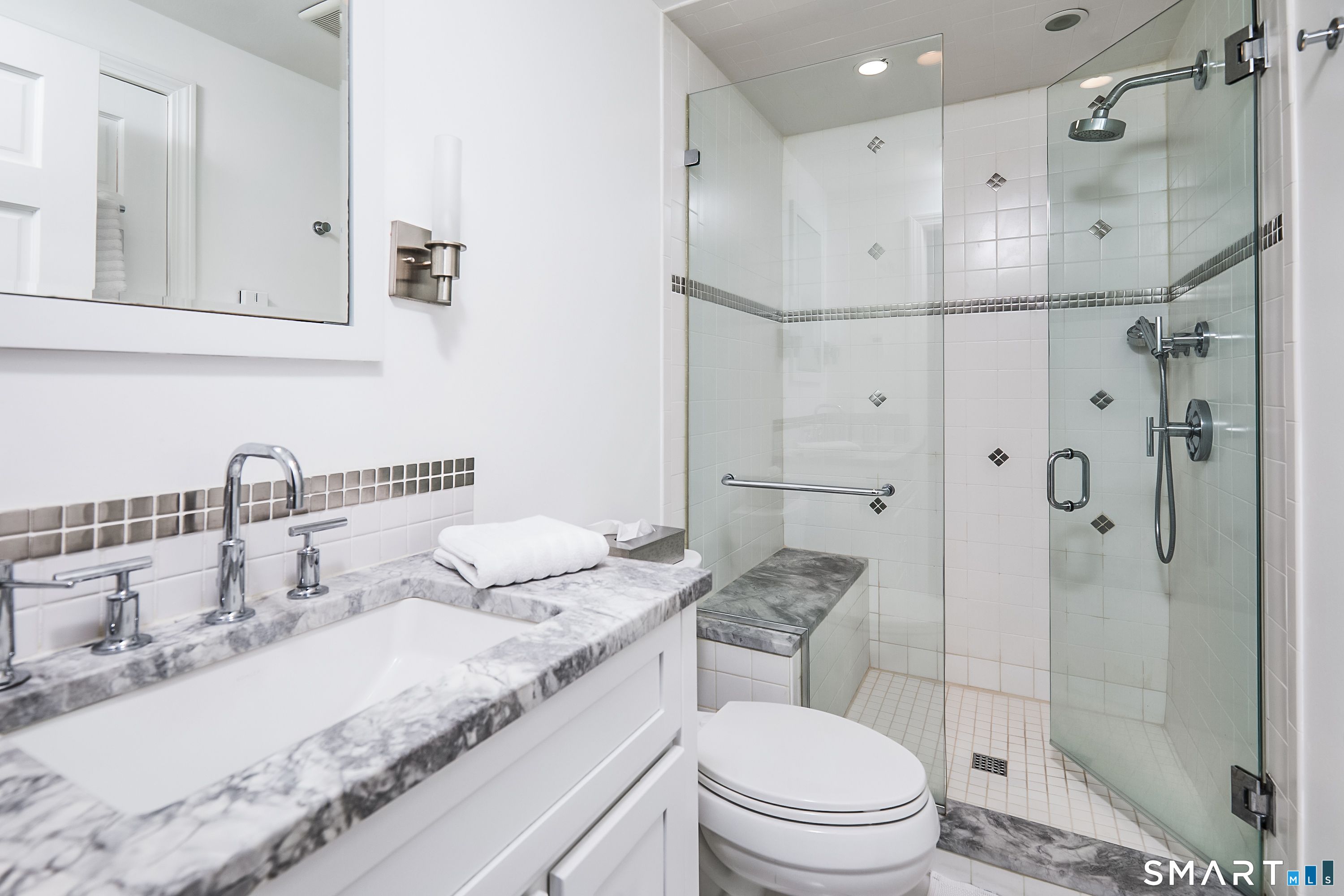 188 Compo Road South Westport, CT 06880 - Photo 25 of 39 a bathroom with a granite countertop sink mirror toilet and shower