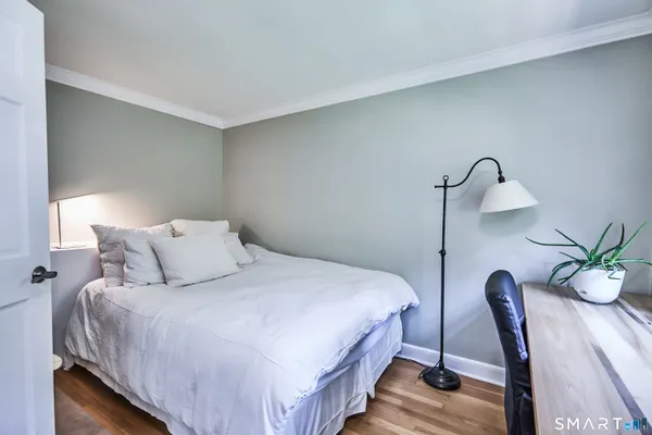 a bedroom with a bed and a table