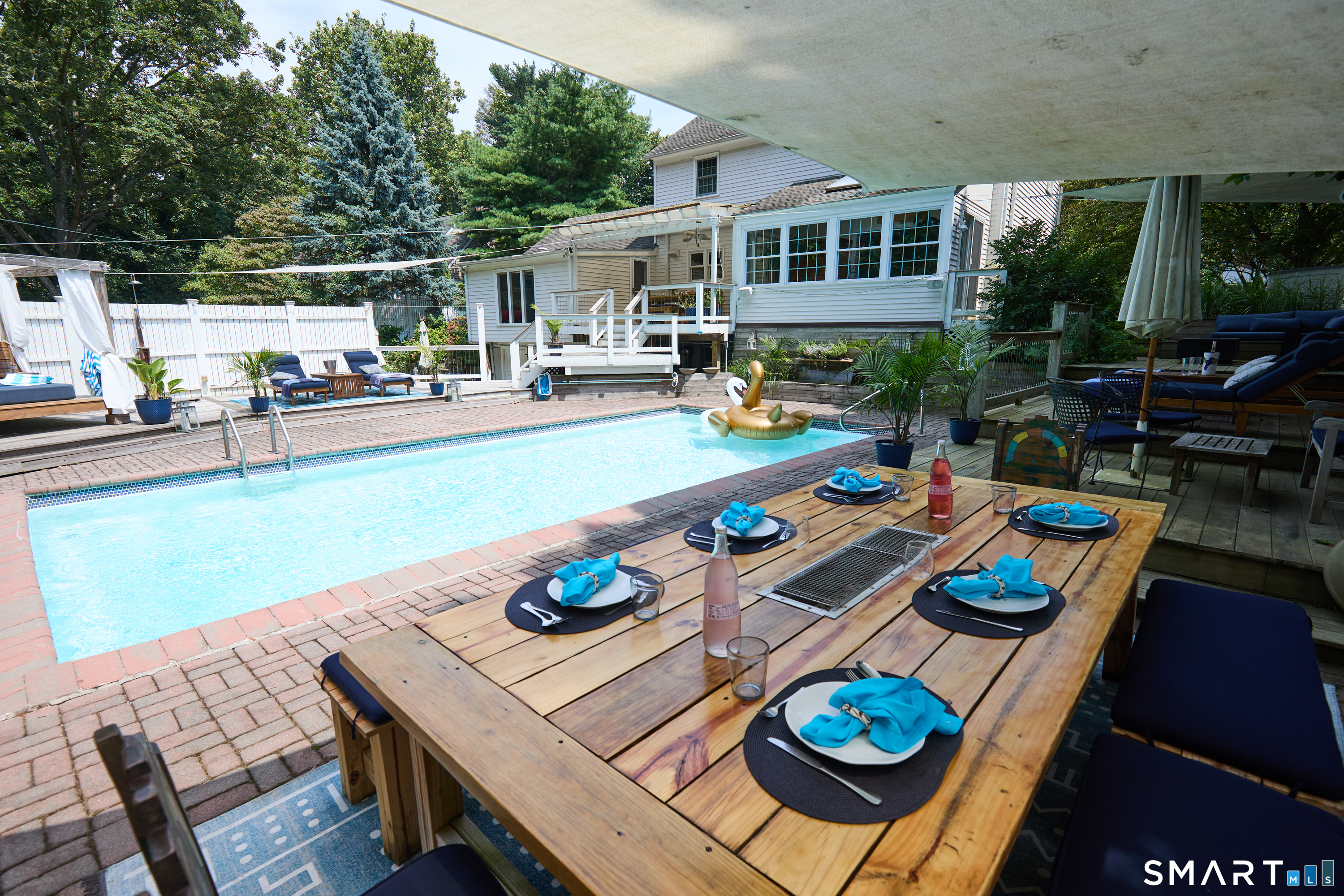 188 Compo Road South Westport, CT 06880 - Photo 36 of 39 a view of a dinning table and chairs in the patio