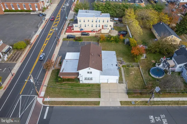 an aerial view of pool with patio