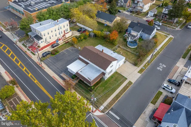 an aerial view of houses with swimming pool