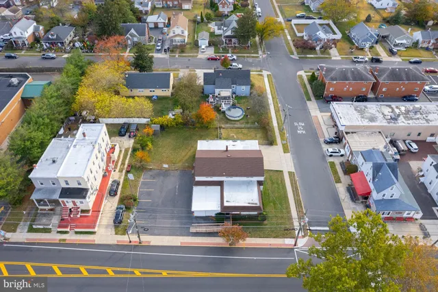 an aerial view of a house with a swimming pool