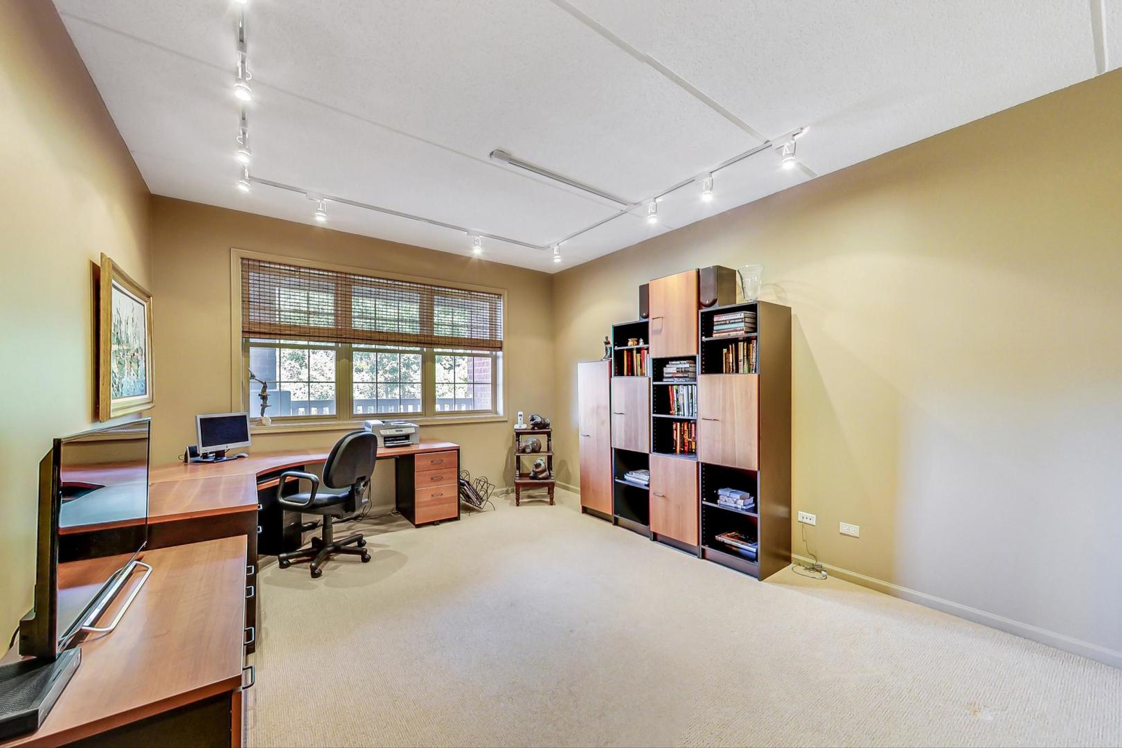 950 Augusta Way, Unit 204 Highland Park, IL 60035 - Photo 20 of 36 a view of a livingroom with furniture and a window