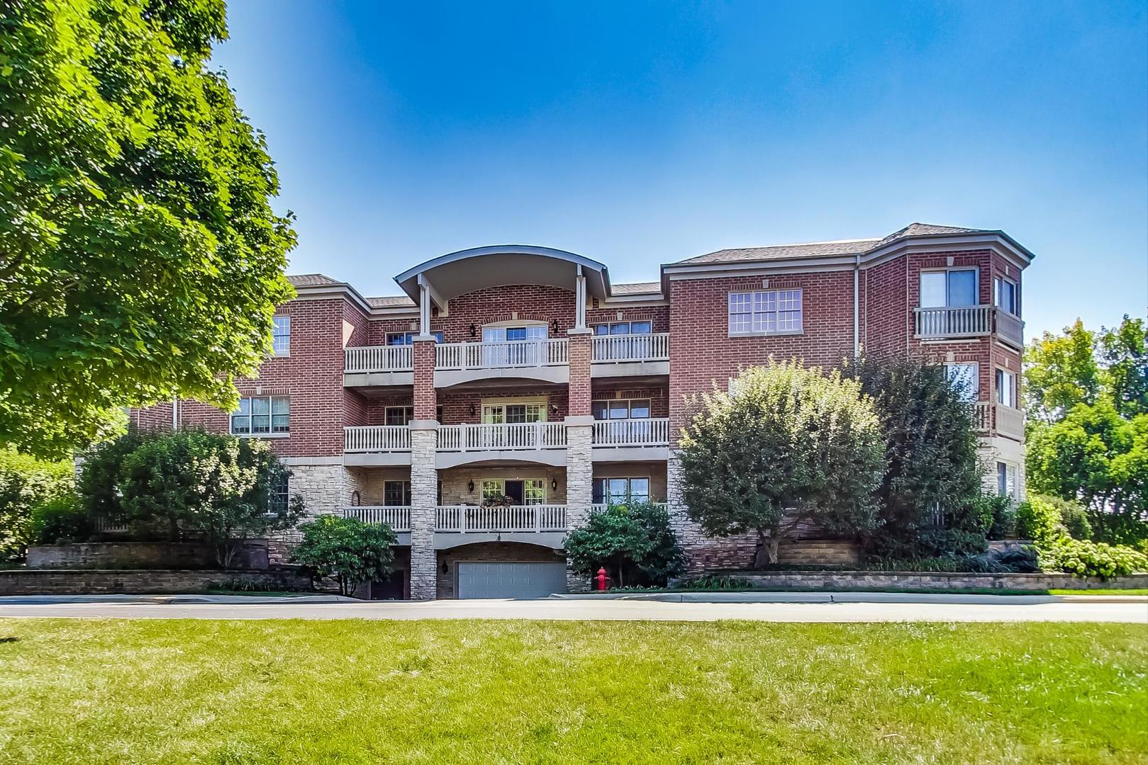 950 Augusta Way, Unit 204 Highland Park, IL 60035 - Photo 26 of 36 a front view of house with yard and outdoor seating