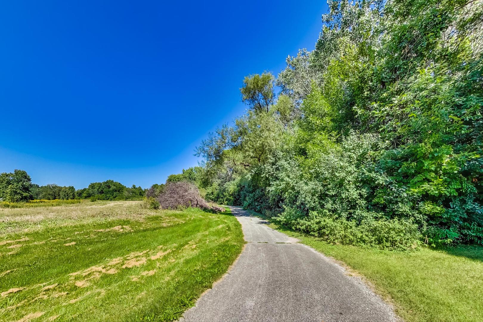 950 Augusta Way, Unit 204 Highland Park, IL 60035 - Photo 31 of 36 a view of a grassy area with an trees