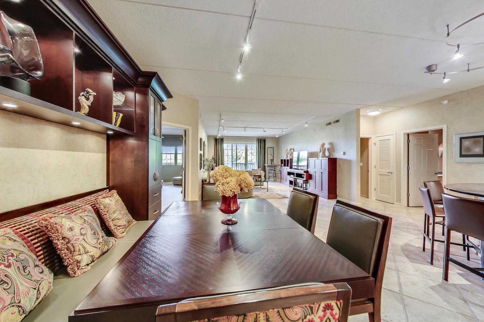 950 Augusta Way, Unit 204 Highland Park, IL 60035 - Photo 9 of 36 a living room with furniture and a dining table