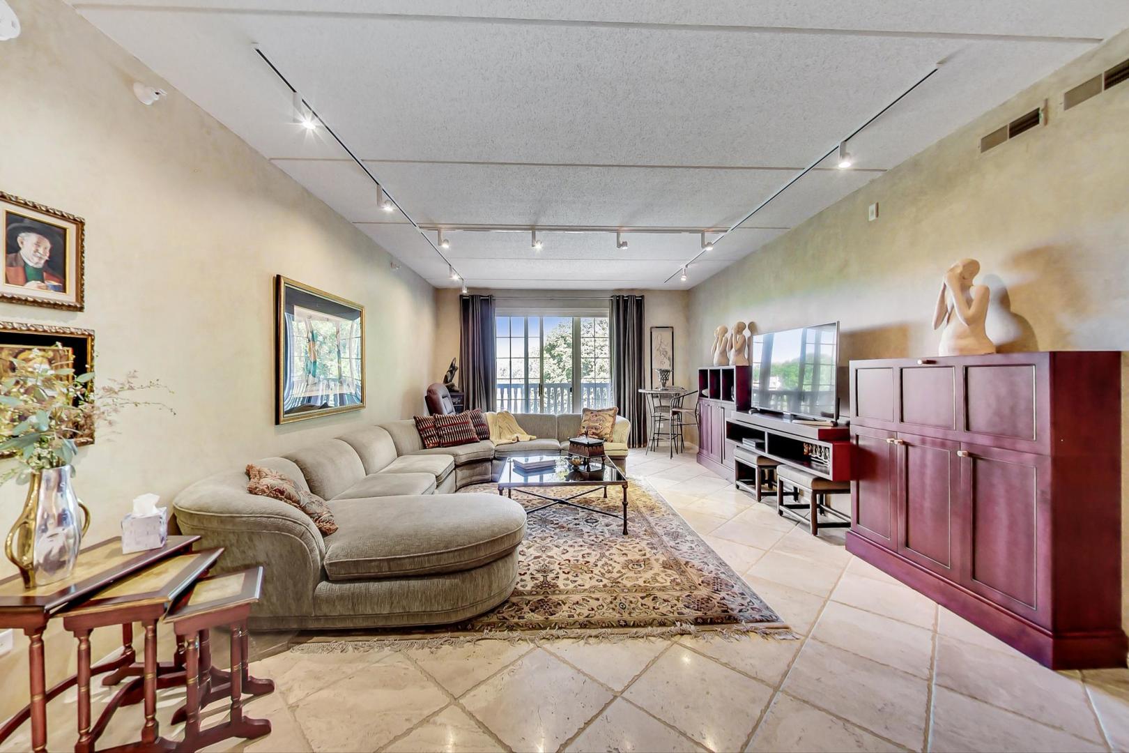 950 Augusta Way, Unit 204 Highland Park, IL 60035 - Photo 10 of 36 a living room with furniture and a wooden floor