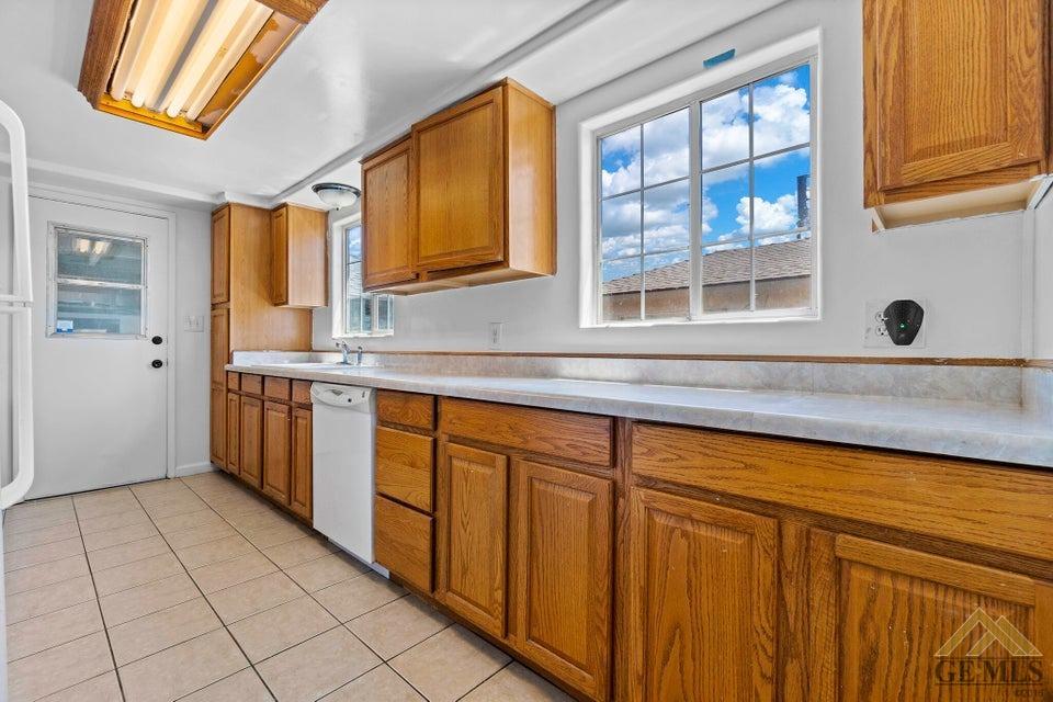 Undisclosed Address Bakersfield, CA 93308 - Photo 16 of 24 a kitchen with stainless steel appliances a sink and a cabinets