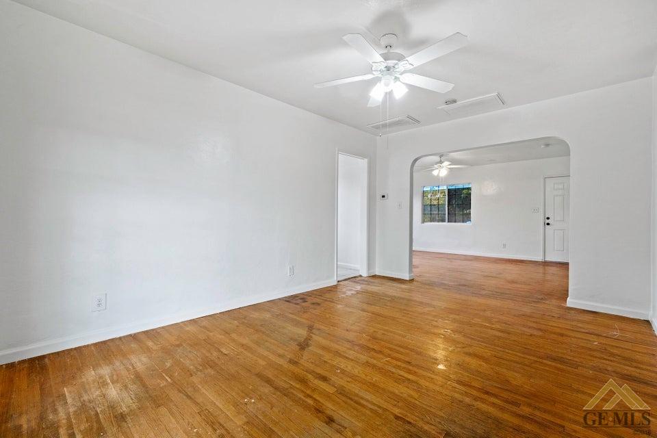Undisclosed Address Bakersfield, CA 93308 - Photo 18 of 24 a view of an empty room with wooden floor