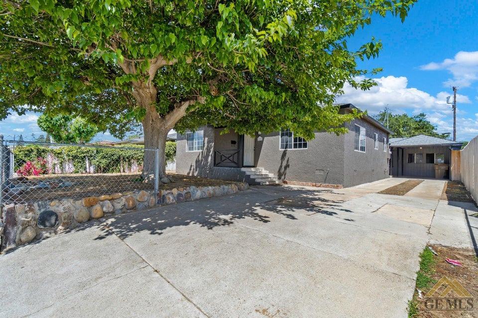 Undisclosed Address Bakersfield, CA 93308 - Photo 2 of 24 a backyard of a house with table and chairs