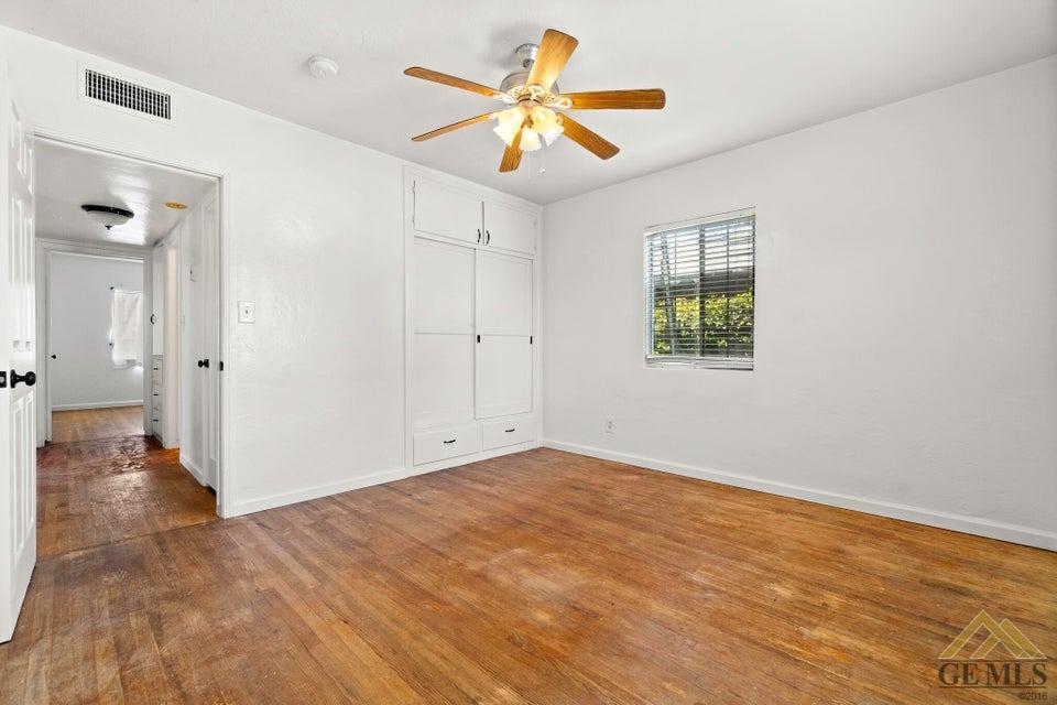 Undisclosed Address Bakersfield, CA 93308 - Photo 8 of 24 wooden floor in an empty room with a window