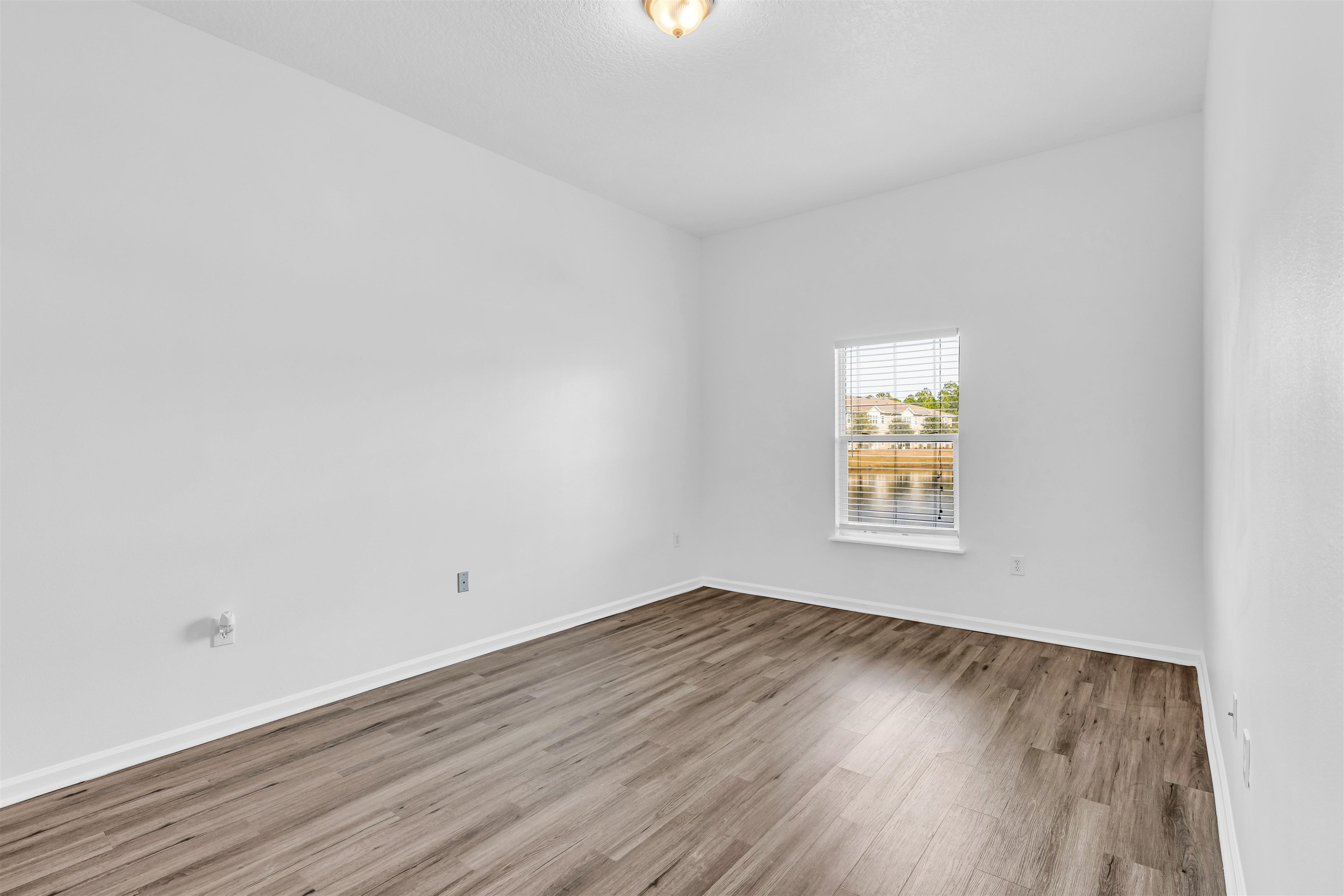 406 Golden Lake Loop St. Augustine, FL 32084 - Photo 12 of 51 an empty room with a window