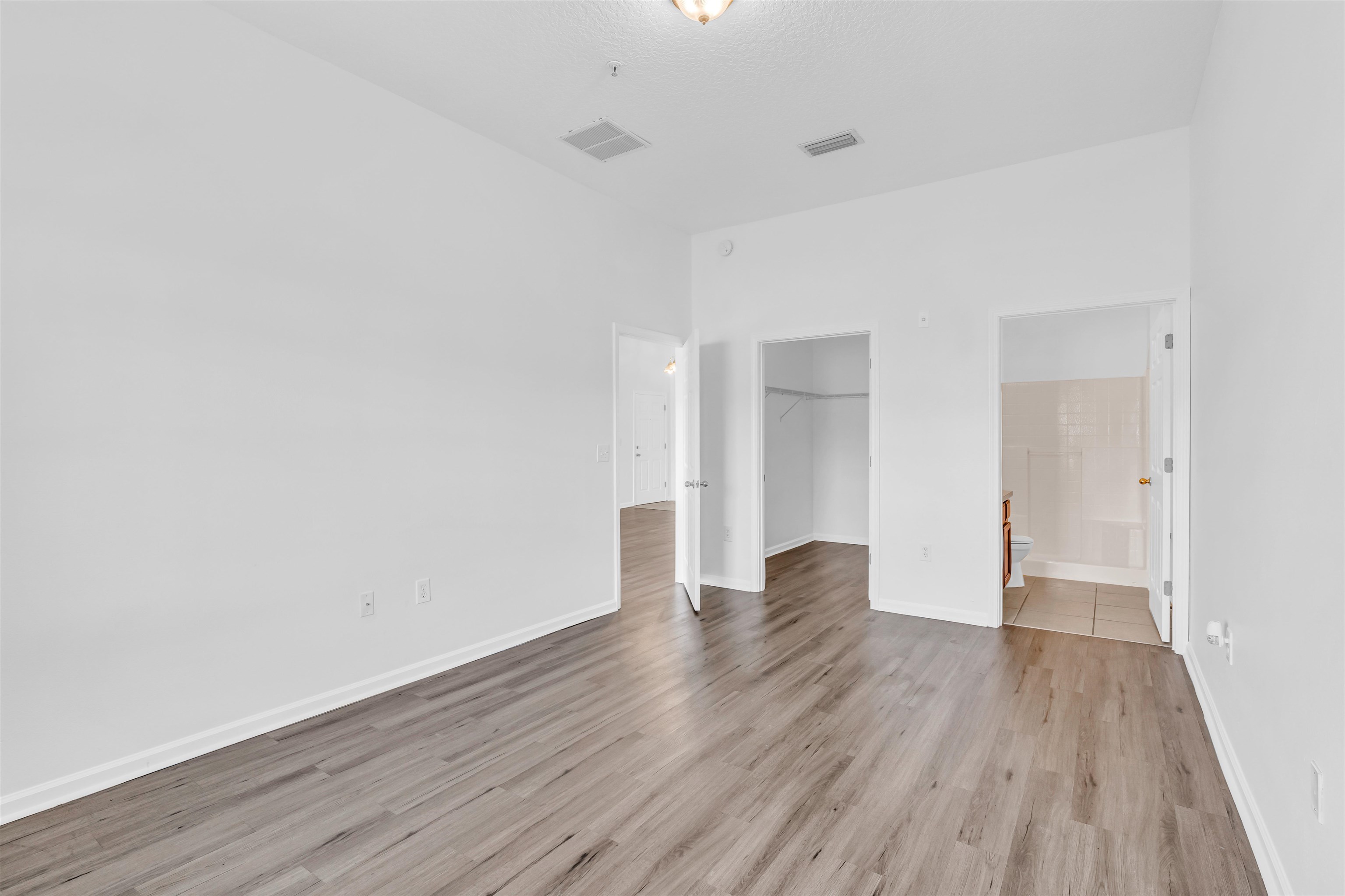 406 Golden Lake Loop St. Augustine, FL 32084 - Photo 13 of 51 a view of an empty room and wooden floor