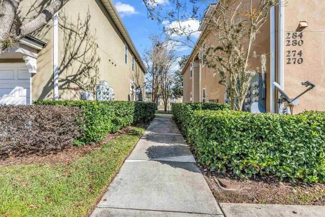 a view of a pathway with house on both side