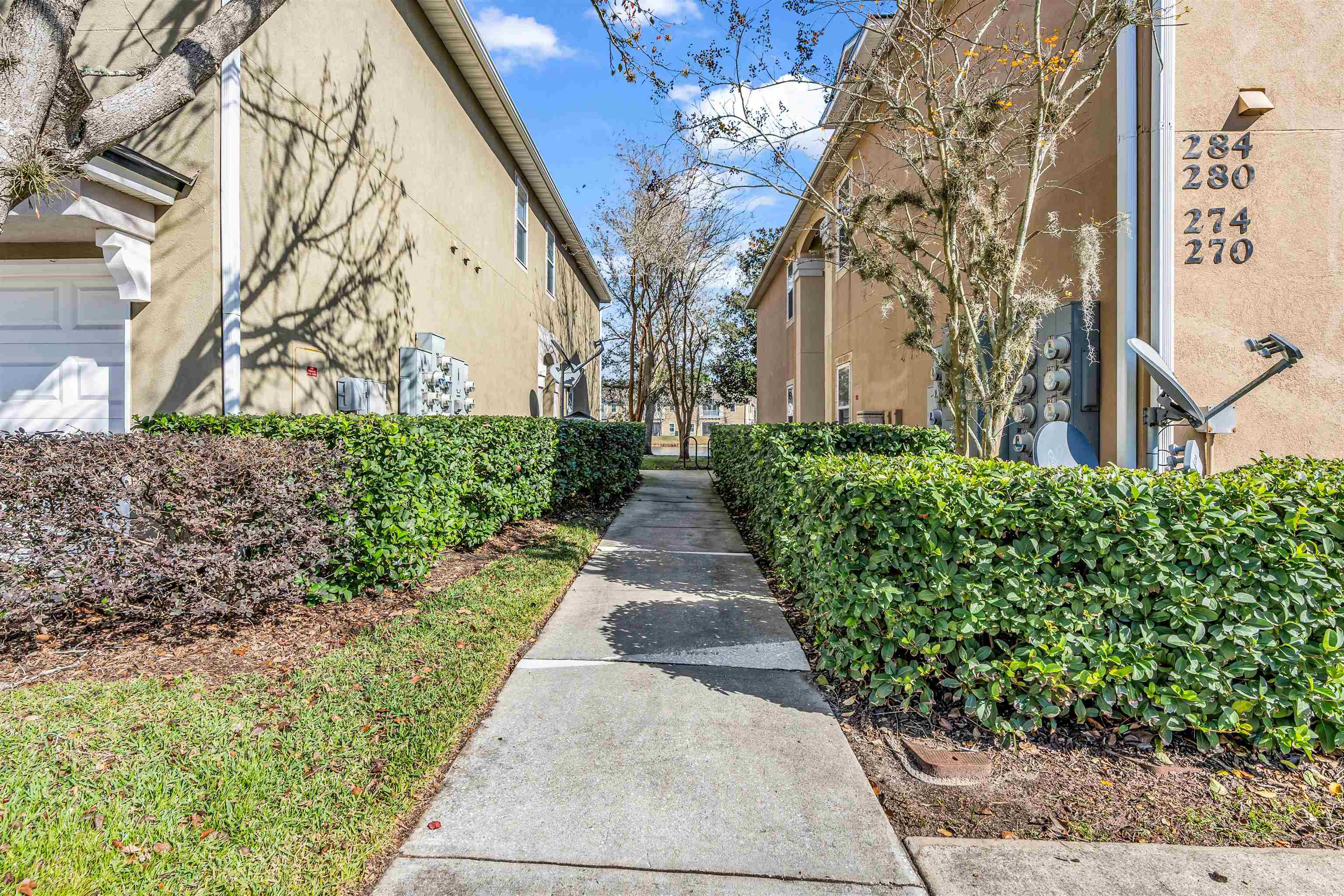 406 Golden Lake Loop St. Augustine, FL 32084 - Photo 24 of 51 a view of a pathway with house on both side
