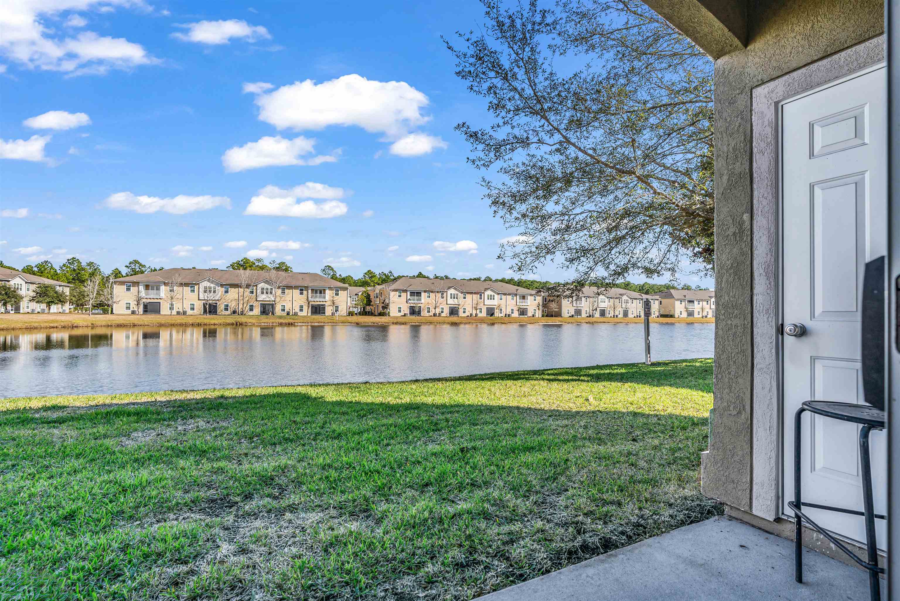 406 Golden Lake Loop St. Augustine, FL 32084 - Photo 28 of 51 a view of a lake with houses in the back