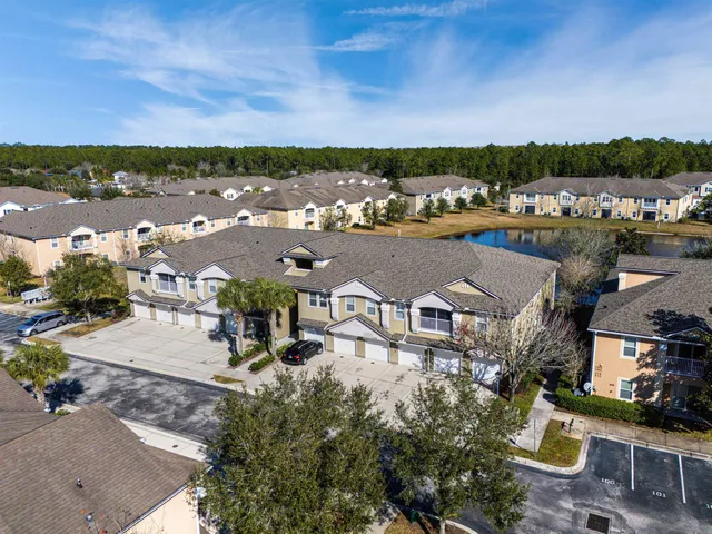 an aerial view of a house with outdoor space