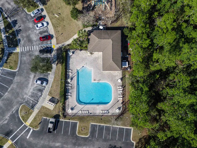 an aerial view of residential house with outdoor space and swimming pool