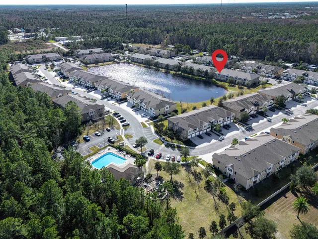 a view of house with swimming pool outdoor seating