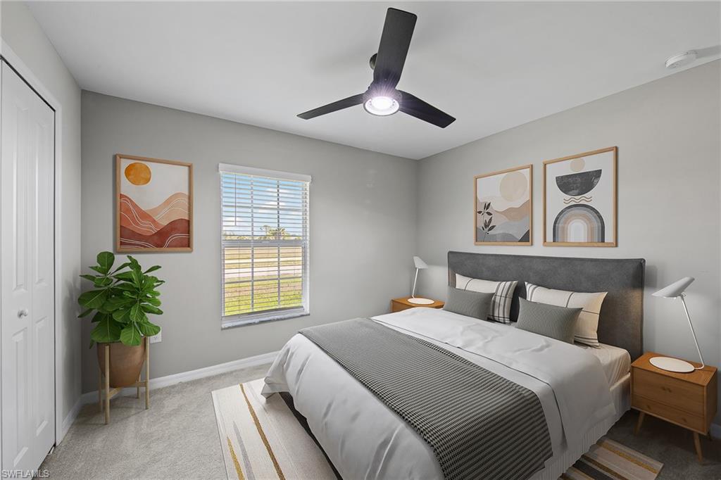 4139 Tulia Way North Fort Myers, FL 33917 - Photo 15 of 32 a bedroom with a bed and a potted plant