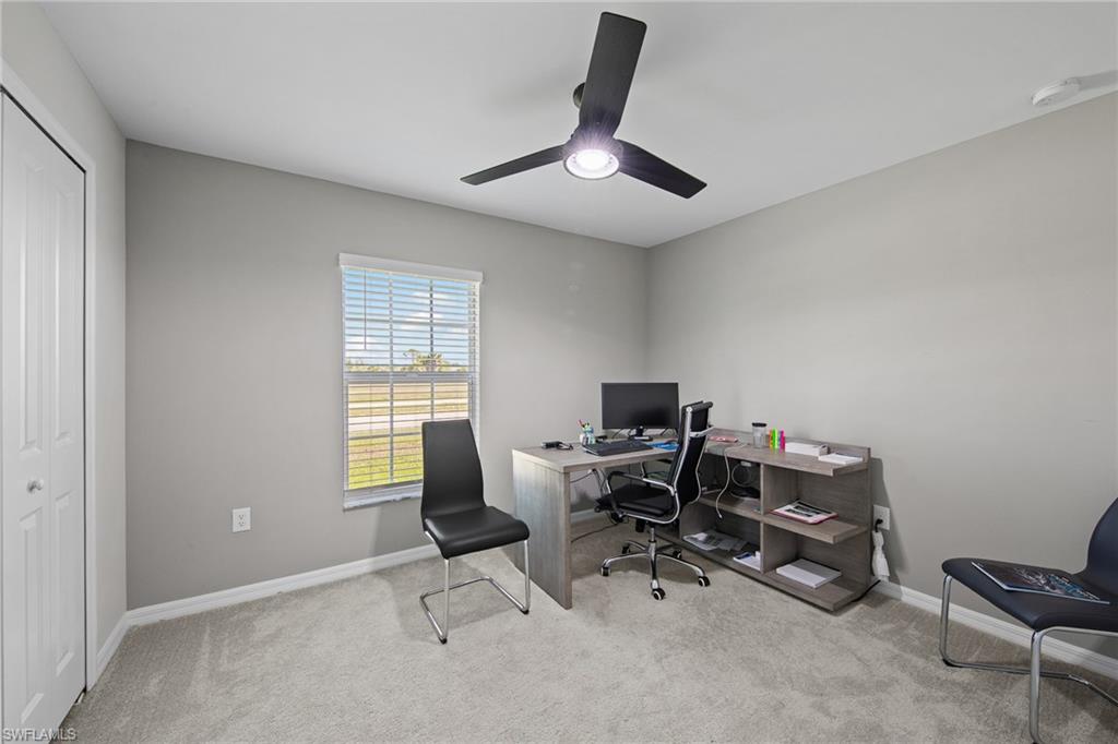 4139 Tulia Way North Fort Myers, FL 33917 - Photo 22 of 32 a view of a workspace with furniture and a window